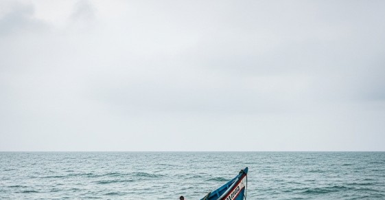 An Image created by AI depicting a boat capsize in the Ocean.